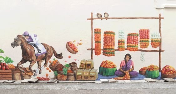 Penang Street Art mural showing a colorful market scene in George Town