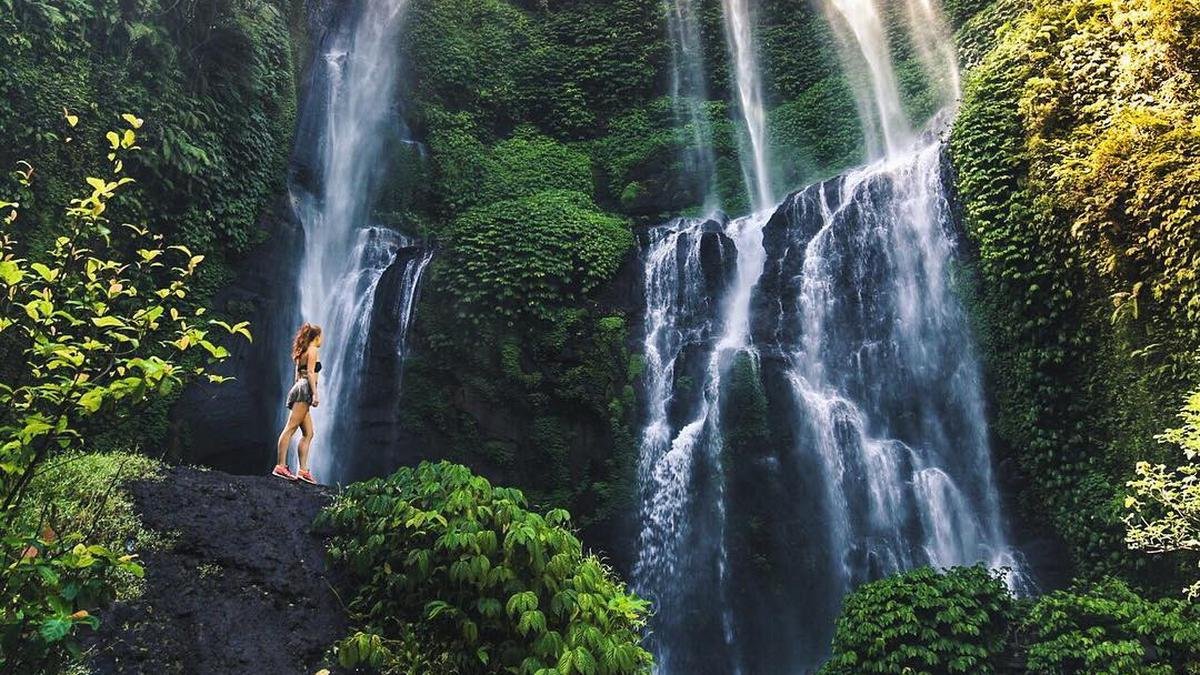 Sekumpul waterfall surrounded by green cliffs in North Bali